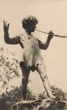 Featured is a postcard image of the statue of Peter Pan in Kensington Gardens (London) ... in honor of the children's classic and its author, James Barrie.  The original real photo postcard is for sale in The unltd.com Store. 